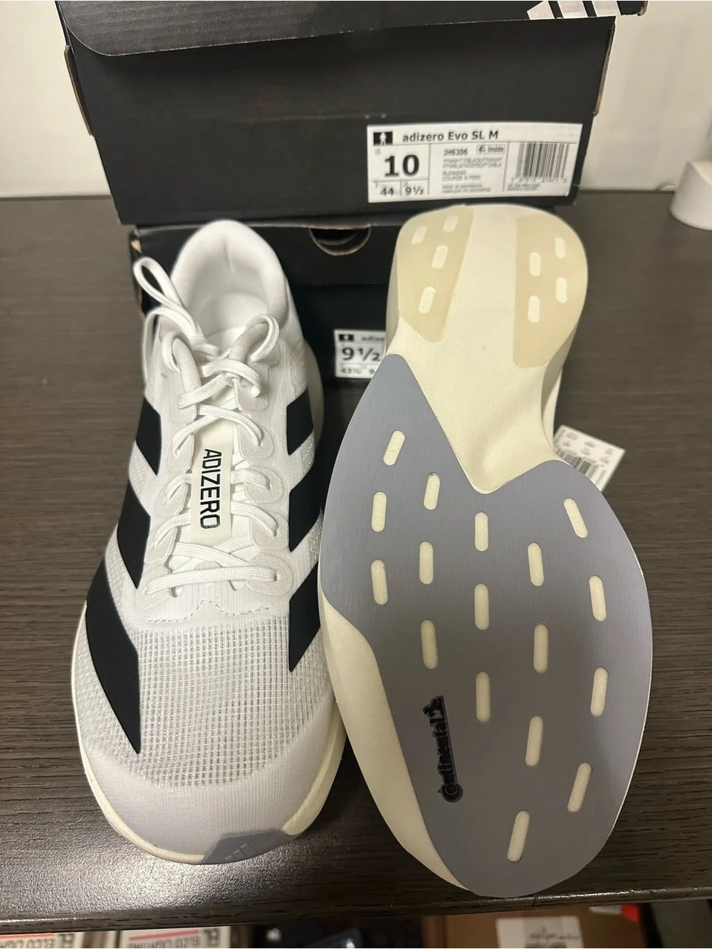Brand New adidas Adizero Evo SL running shoes in Cloud White and Core Black.